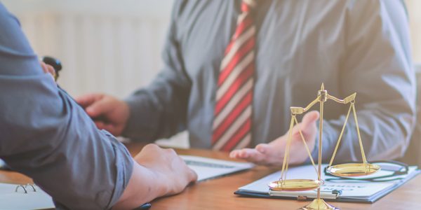 The lawyer is currently consulting on legal contract documents t